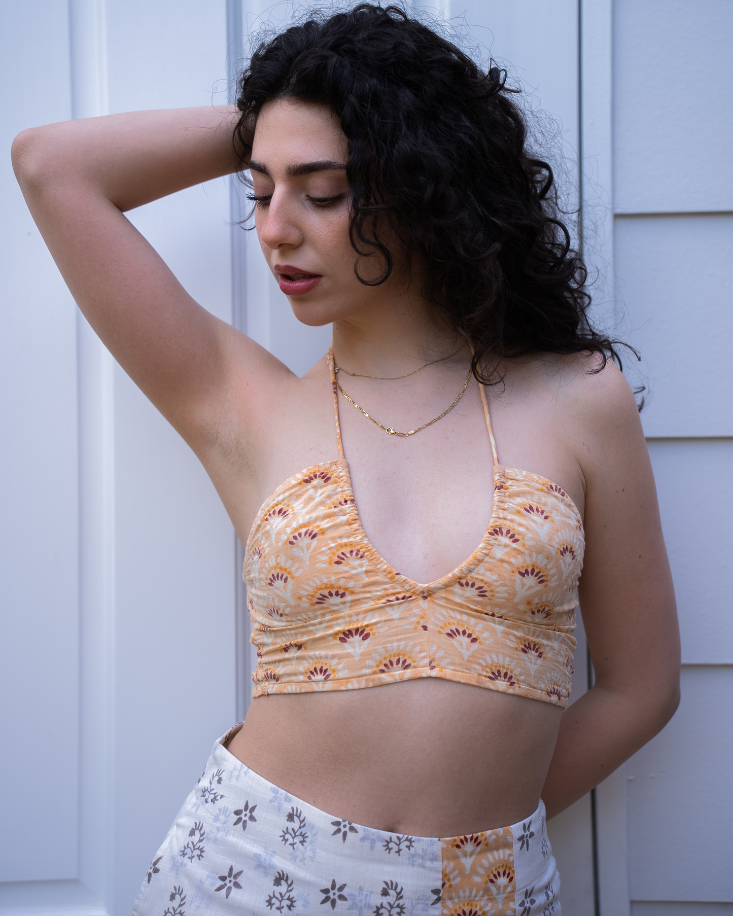 Jaipur halter crop top with Sunrise mini skirt, close-up styling view showing waist fit and print contrast panel 