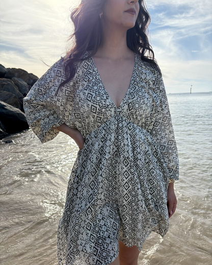 Ria Mini Dress – full body on rocks – black and white geometric print mini dress 