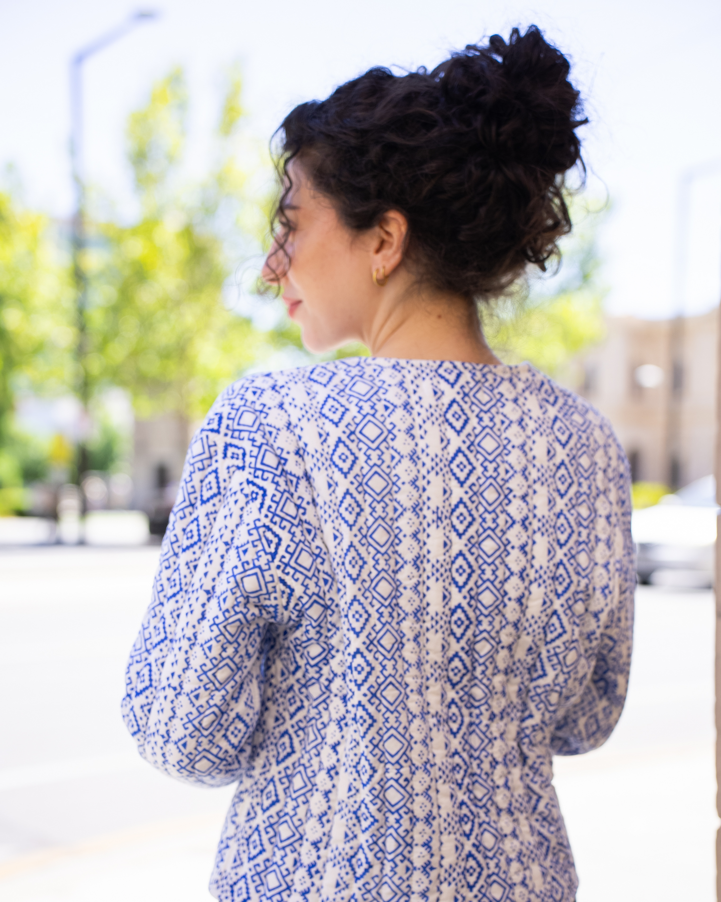 Sapphire Quilted Jacket – back view on model – blue and white geometric hand-block print quilted cotton 