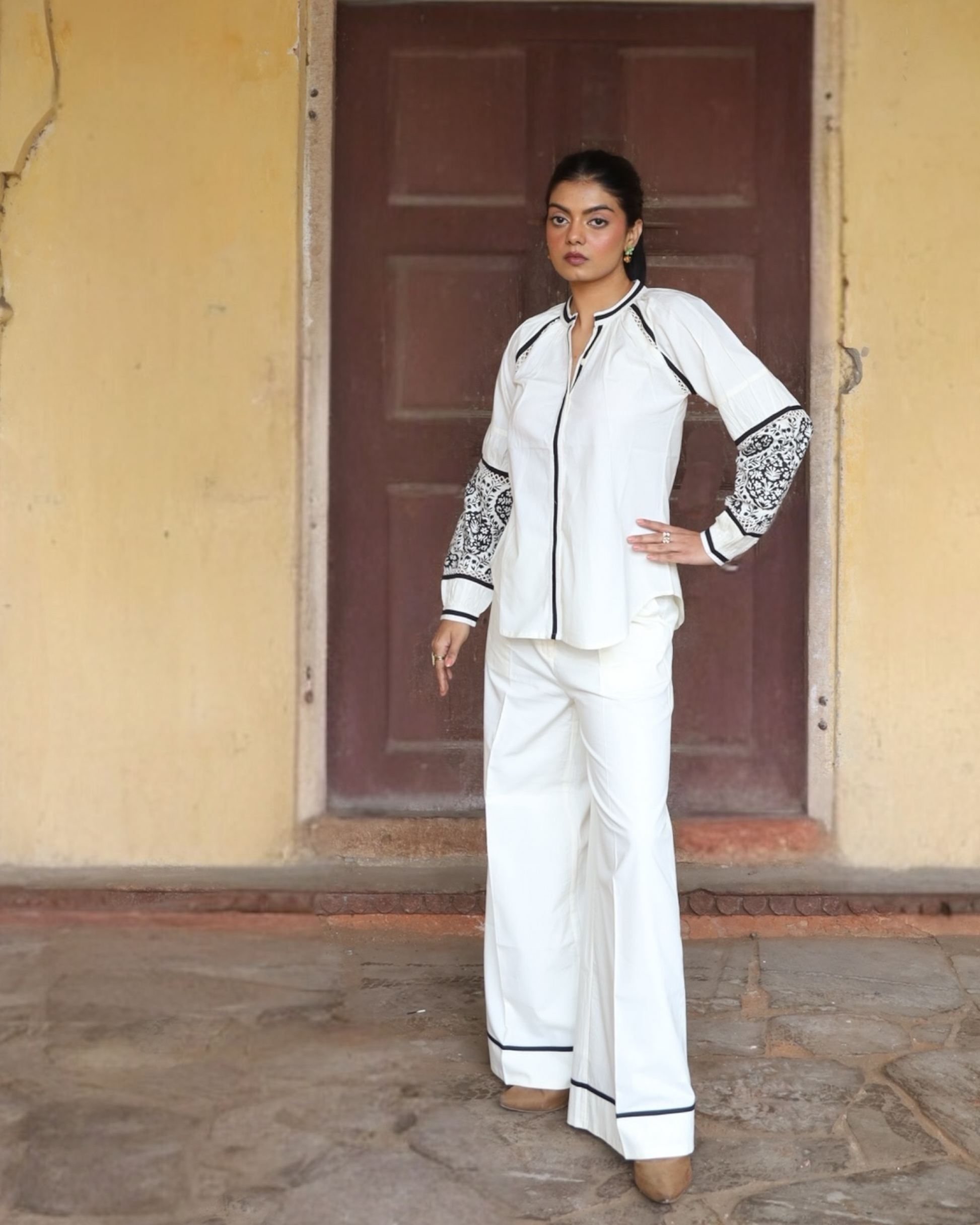 Sophia blouse and pant set in white cotton with black piping and block-printed sleeves, full-length front view