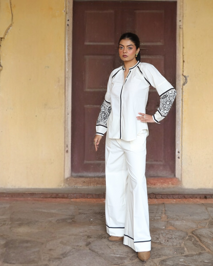 Sophia blouse and pant set in white cotton with black piping and block-printed sleeves, full-length front view