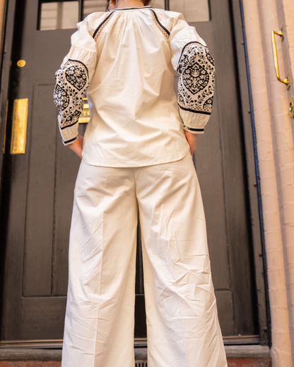 Back view of Sophia blouse and wide-leg pants set, showing sleeve block print placement and relaxed fit 
