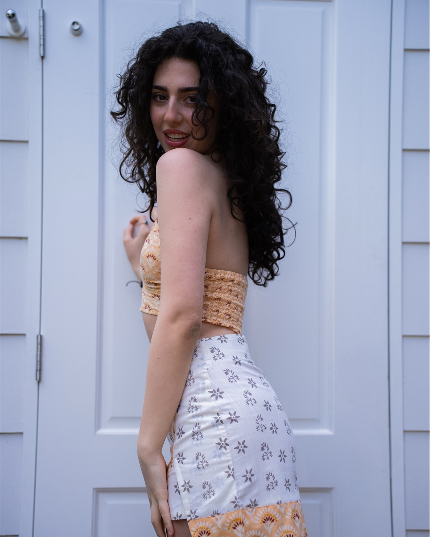 Sunrise mini skirt front view, high-waisted faux wrap style in mandarin cream floral block print cotton