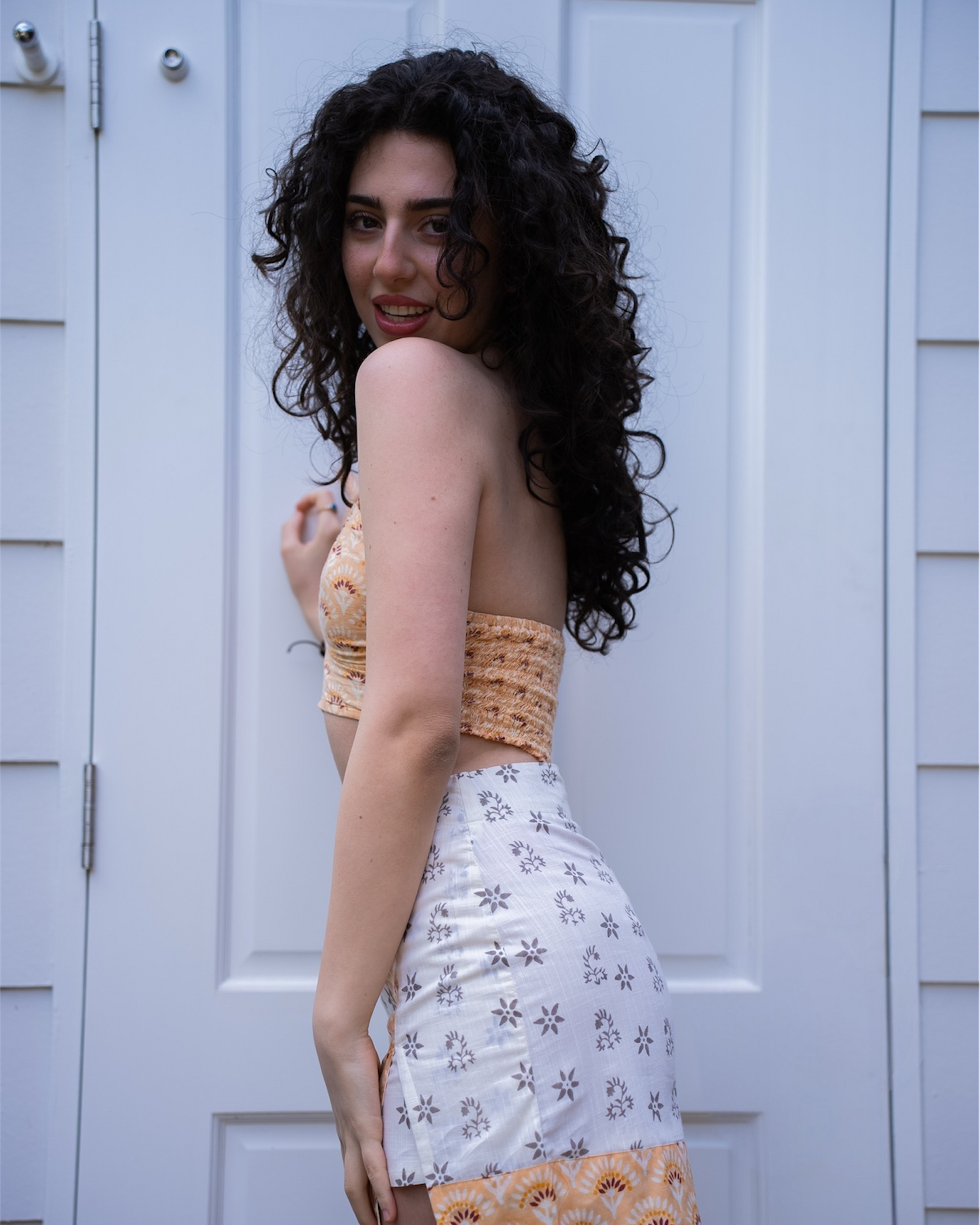 Sunrise mini skirt front view, high-waisted faux wrap style in mandarin cream floral block print cotton